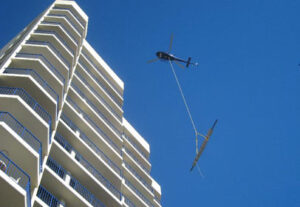 Surf Regency helicopter lift to re-roof sauna room & entertainment area